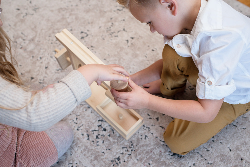 Kids playing with wooden toy